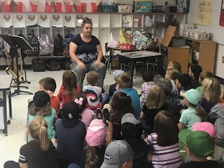 The students eagerly listen to Mrs. Jody.